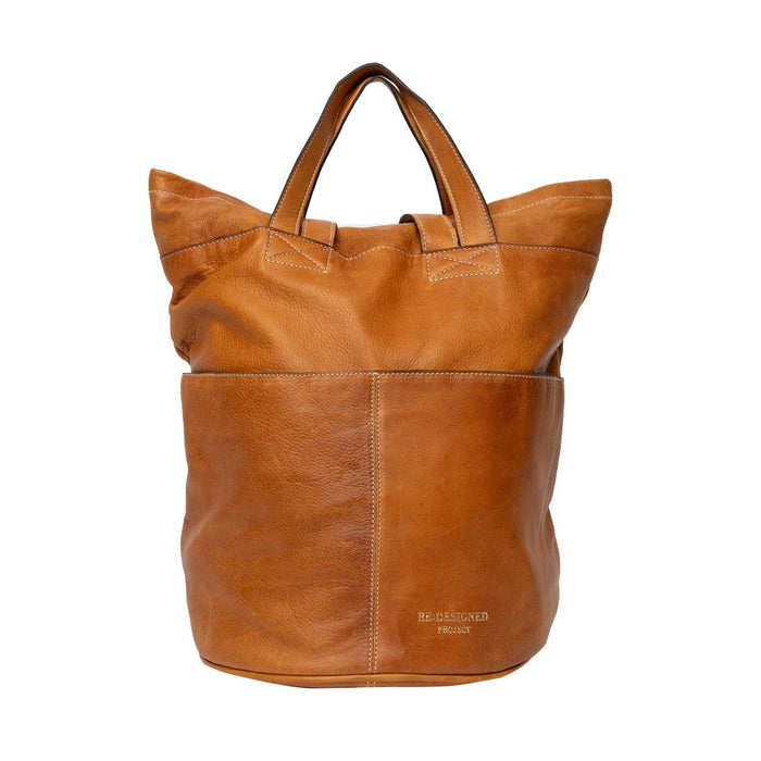 Burned Tan Project 24 Backpack, handcrafted leather design with multiple pockets for organizing knitting essentials.