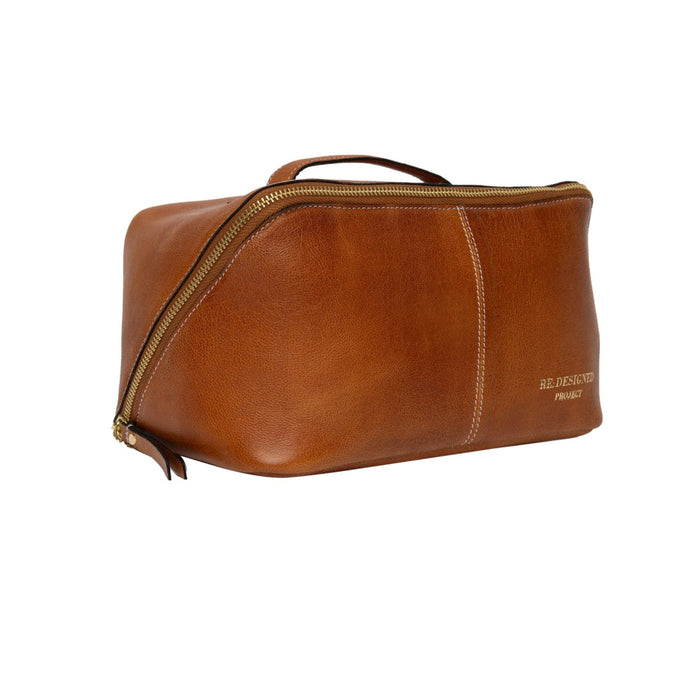 Knitting bag in burned tan/gold leather with patinated finish.