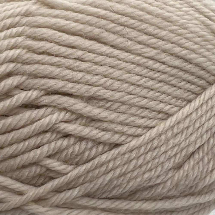 Close-up of cream-colored 8ply merino yarn for Goldie Sweater & Hat Knit Kit.
