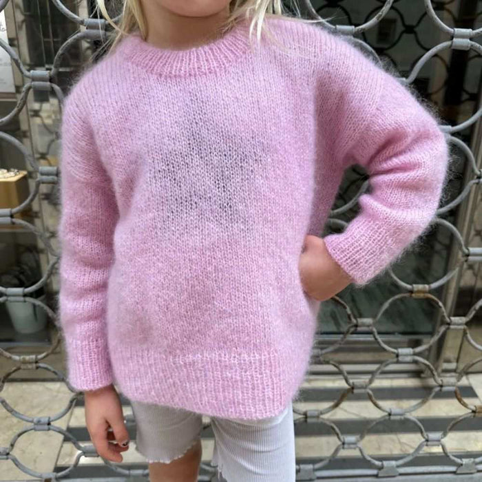 PetiteKnit Stockholm Sweater Junior in pink, modeled by child.