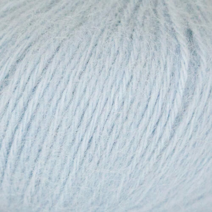Close-up of Chaska Alpaca Air 12-ply yarn in light blue, showing its soft and airy texture.