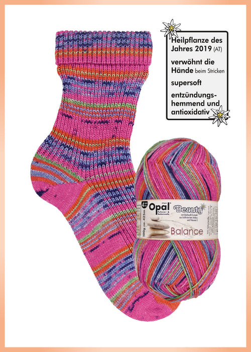 Opal Beauty Balance Sock Yarn in bright multi-color with knitted sock.