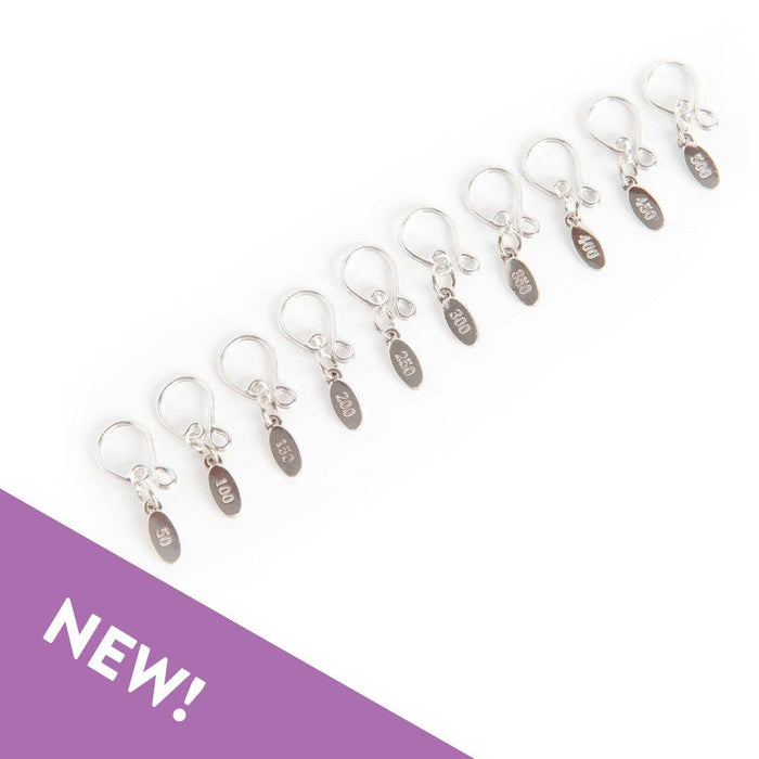 Set of silver cast-on counting stitch markers numbered 50 to 500 with easy-to-move melody clips for knitting organization and precision