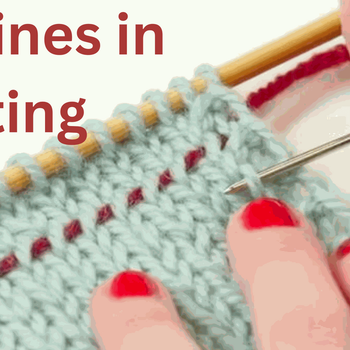 Close-up of knitting project with a lifeline threaded through live stitches for error correction