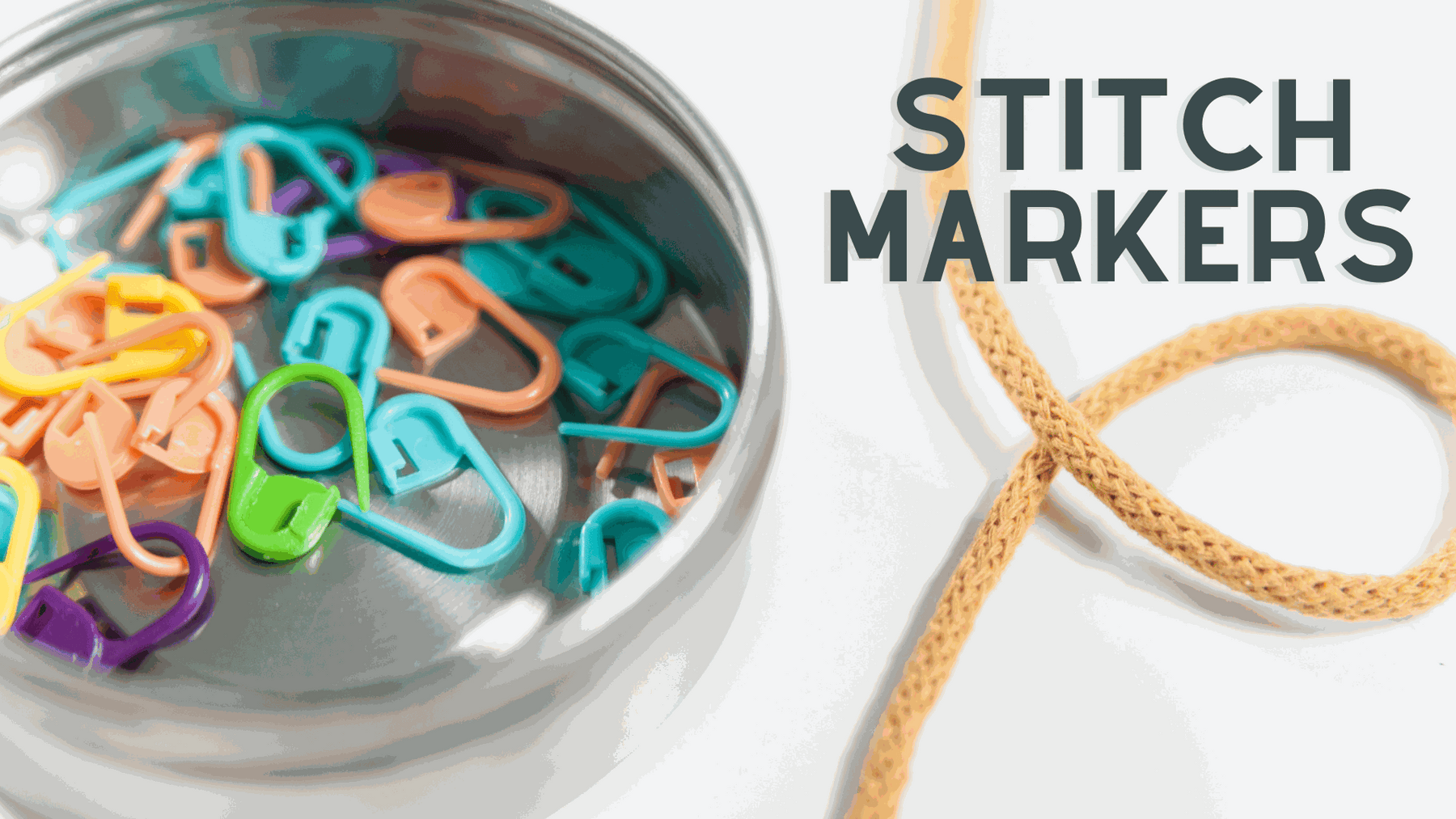 colorful plastic locking stitch markers for knitting on a white background