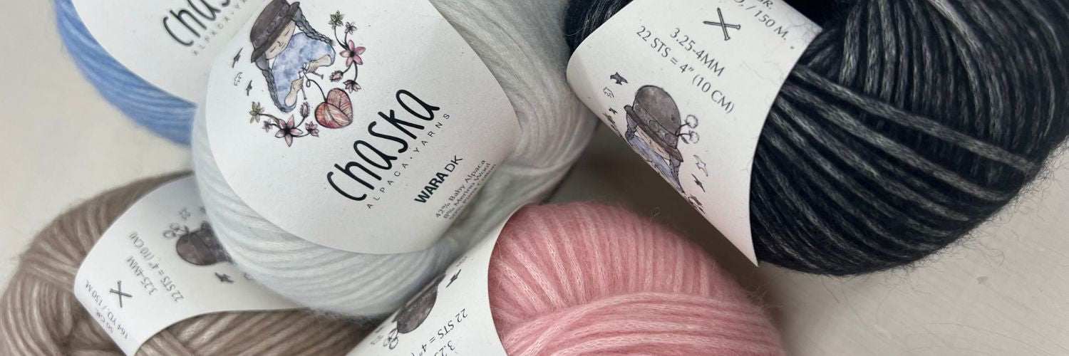 Close-up of soft, fluffy blown yarns made from baby alpaca, merino wool, and Pima cotton