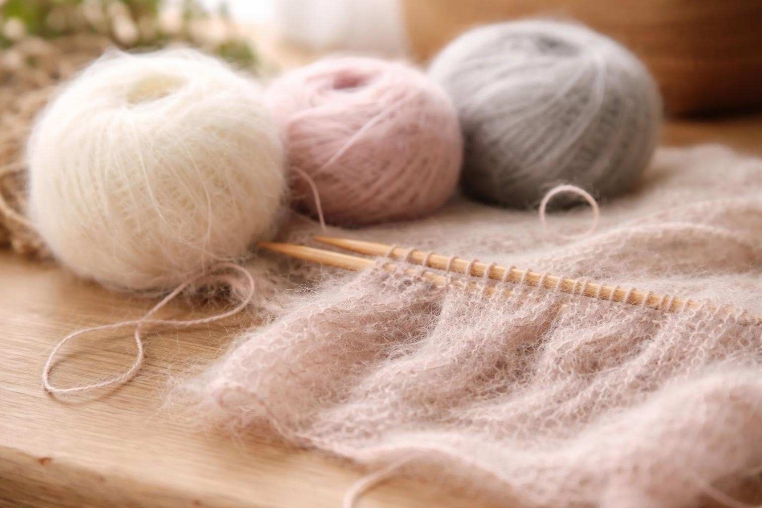 Close-up of mohair thread revealing its distinctive soft halo effect and fine texture for knitting projects