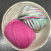 Hand-knitted baby blanket with chevron pattern and matching crochet bunny toy in soft New Zealand Merino wool