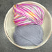 Hand-knitted baby blanket with chevron pattern and matching crochet bunny toy in soft New Zealand Merino wool