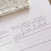 Knit Notes Folder A4 record sheet with minimalist design and spaces for knitting project details, pre-punched holes for swatches and binder, printed on premium card.