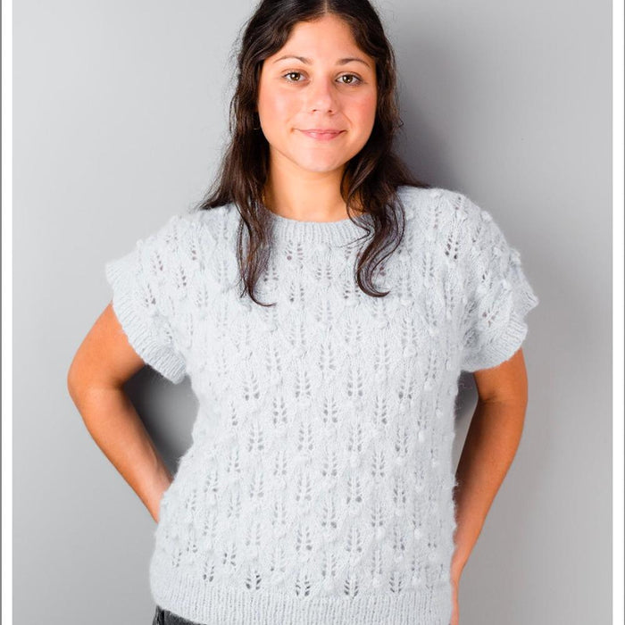 Sleeveless knitted floral vest with lace and bobble details in soft alpaca yarn