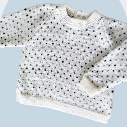 Children's v-neck top-down sweater with greywacke naturals 4ply yarn and all-over dot pattern