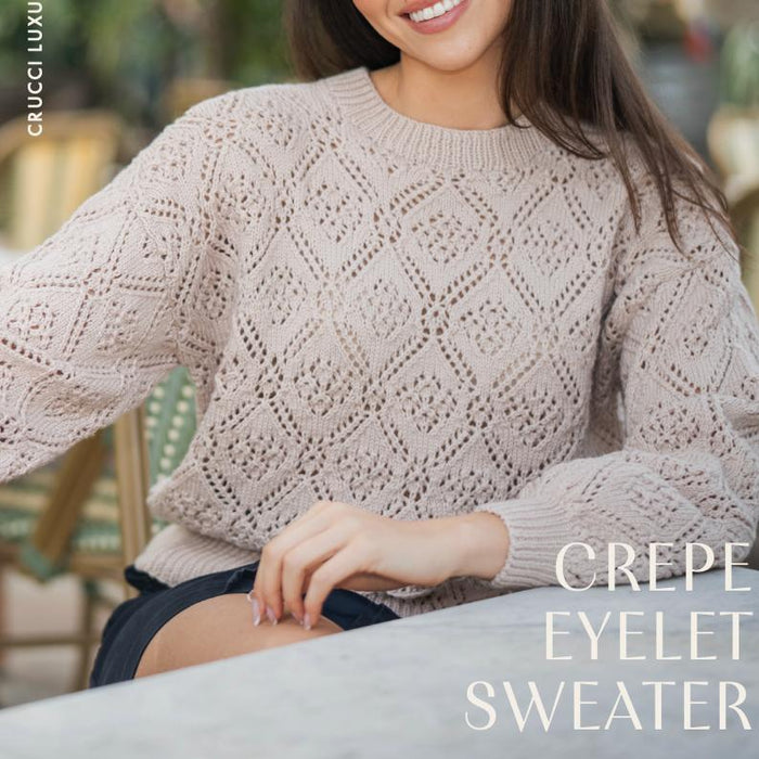 Lightweight luxury merino crepe sweater with all-over geometric eyelet lace pattern and crew neckline
