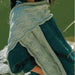 Crescent-style Urpi shawl with wave lace border and wildflower-knot texture knitted flat with short rows