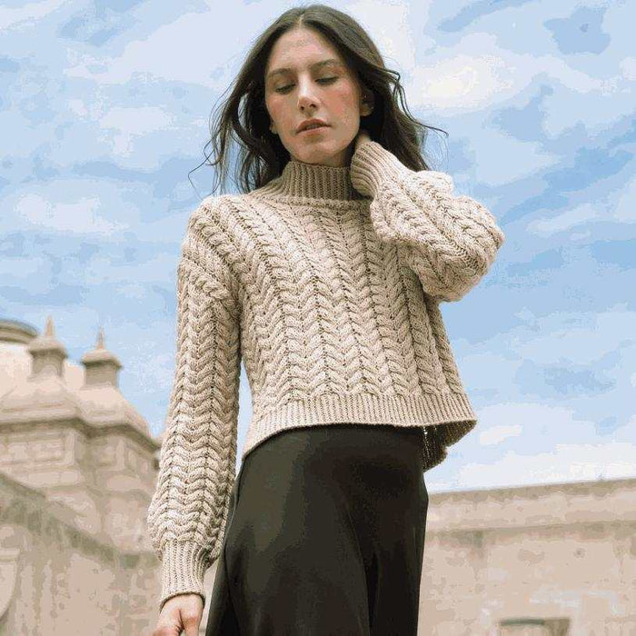 Soraya Pullover knitting pattern featuring textured cables and twisted-rib trims in Amano Duna Rawi yarn