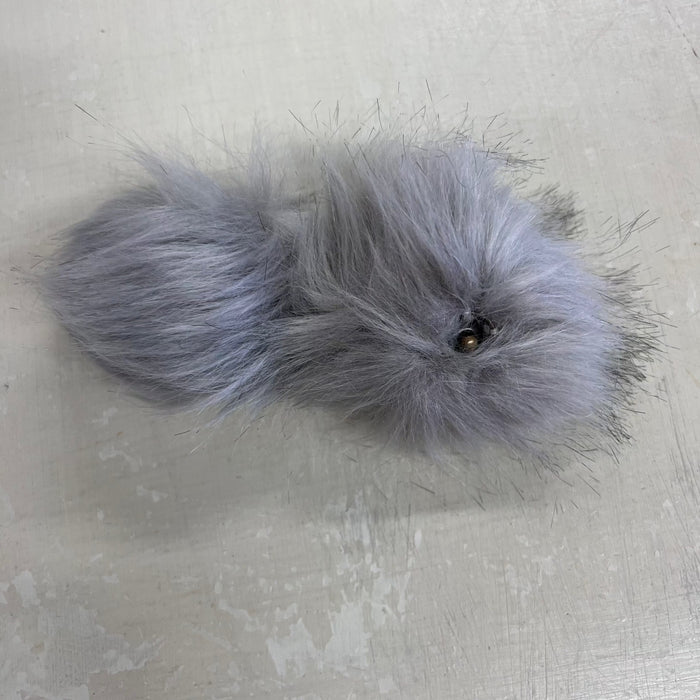 Faux fur pom pom with snap fastener for beanies, approximately 10cm, fluffy and versatile accessory.