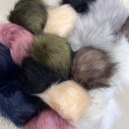 Faux fur pom poms with snap fasteners in assorted colors, 12cm diameter, perfect for beanies and accessories.