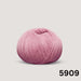 Summer Raglan Cardigan & Hat Knit Kit featuring a ball of smooth pink cotton yarn with a neatly wound texture.