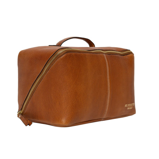 Knitting bag in burned tan and gold leather with spacious storage for projects.