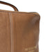 Knitting bag in taupe leather with a patinated finish, ideal for organizing sweater projects.