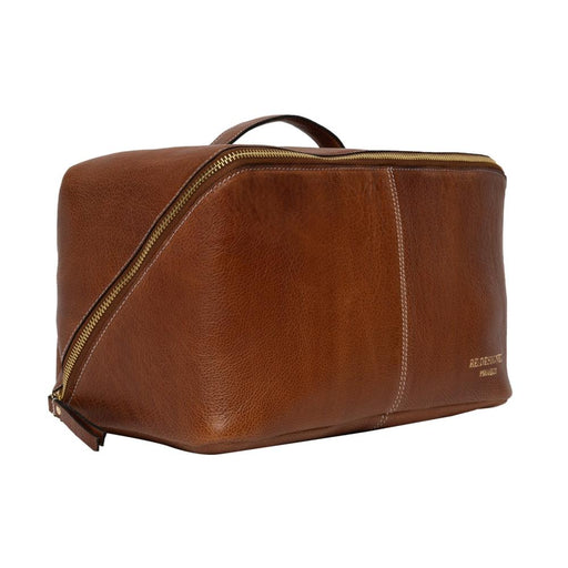 Knitting bag in walnut and gold leather with a patinated finish, featuring a beauty-box style design and dedicated compartments for knitting accessories.