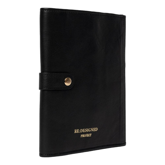 Black and gold leather interchangeable knitting needle case, featuring multiple pockets and snap closures for organizing tools.