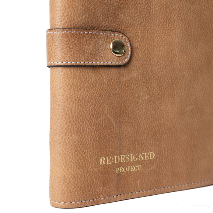 Taupe leather Project 14 interchangeable needle case with snap closure for organizing knitting accessories.