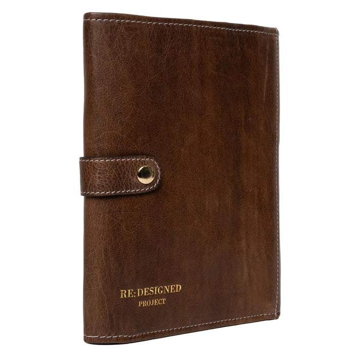 Knitting needle case in woodsmoke leather, featuring multiple pockets and snap closure for organized needle storage.
