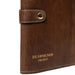 Knitting needle case in woodsmoke leather with snap closure for organizing tools.