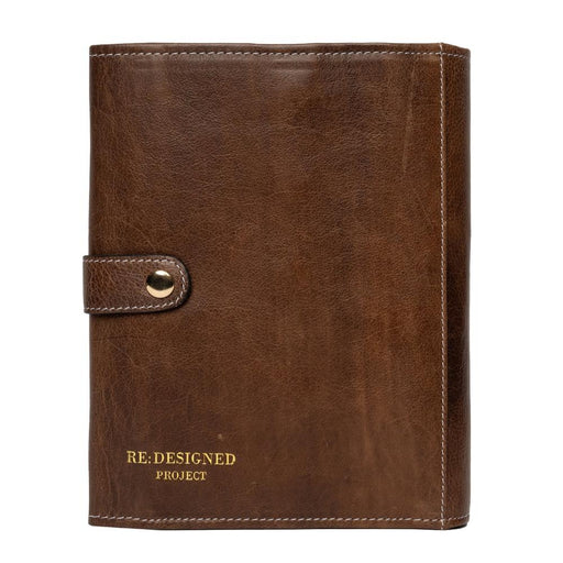 Knitting needle case in woodsmoke leather with snap closure, designed for organizing needles and accessories.