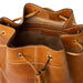 Genuine leather knitting bucket bag with drawstring in burned tan/gold.