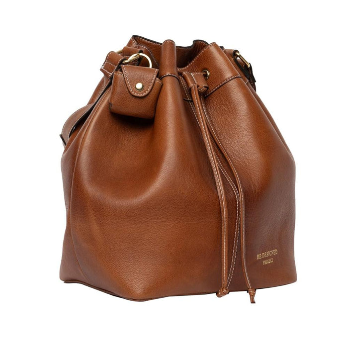 Genuine leather knitting bag in walnut with adjustable strap and drawstring.