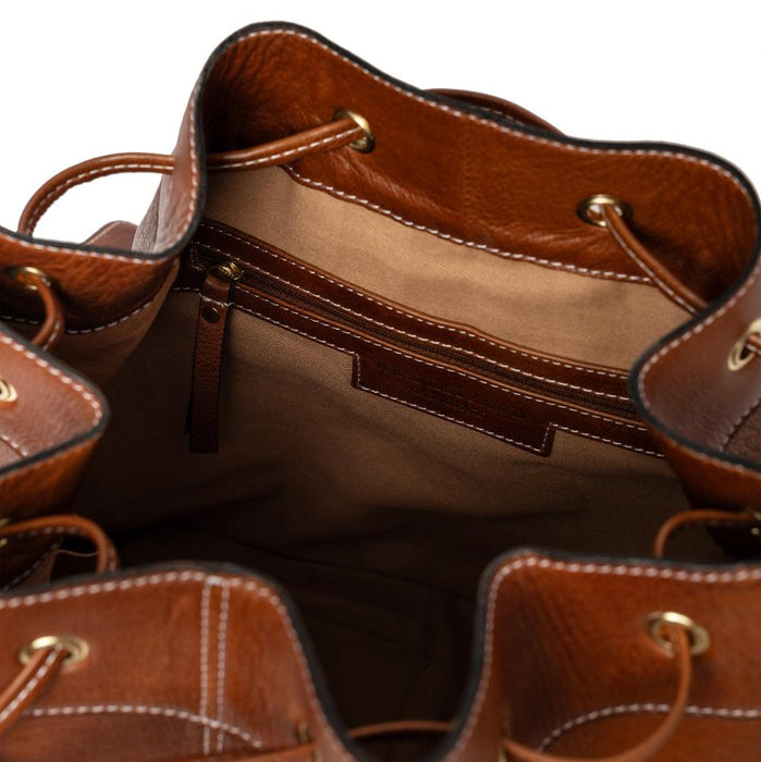 Genuine leather knitting bucket bag in walnut with zip and open pockets, leather drawstring, and adjustable strap.