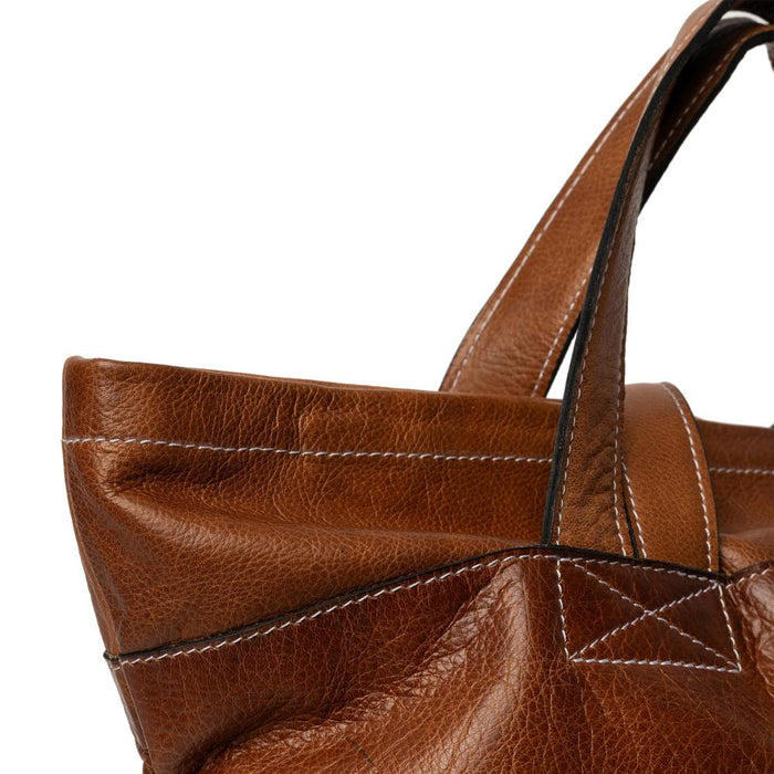 Walnut leather knitting backpack with multiple pockets for organization.