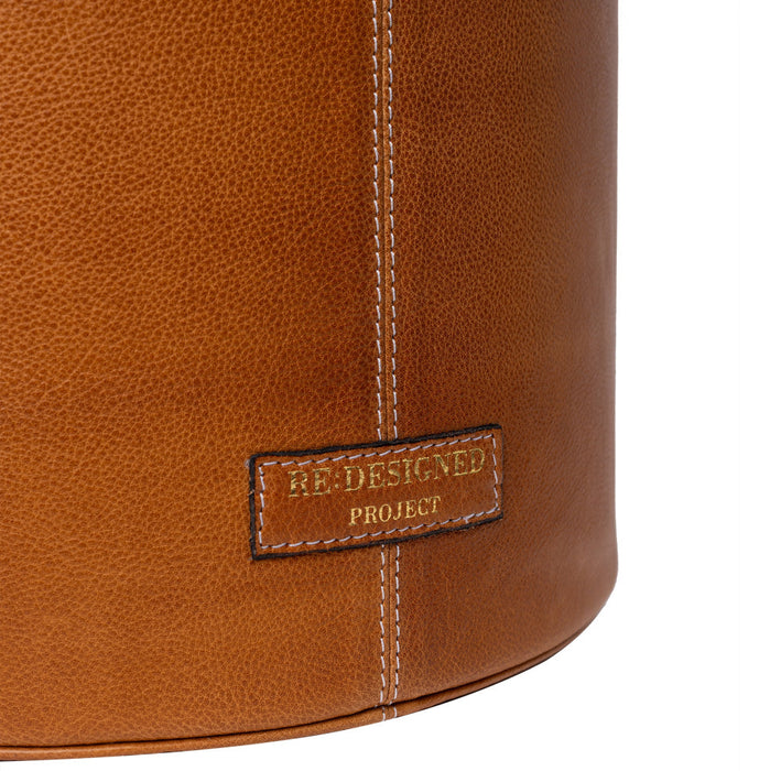 Project 26 Small Bucket Bag in Burned Tan leather with visible stitching and label.