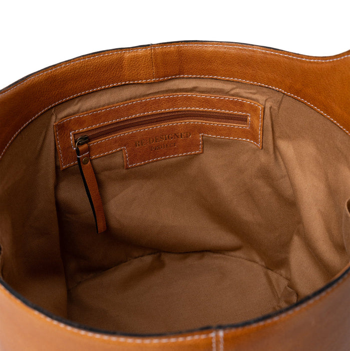 Project 26 Small Bucket Bag in Burned Tan leather with interior view showing spacious design and craftsmanship.