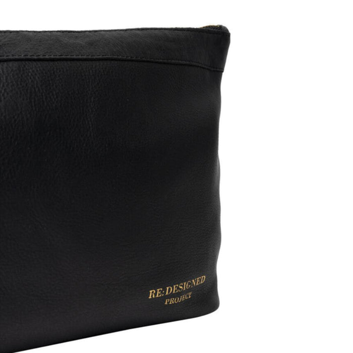 Black and gold leather knitting bag with metal zipper and side handle.