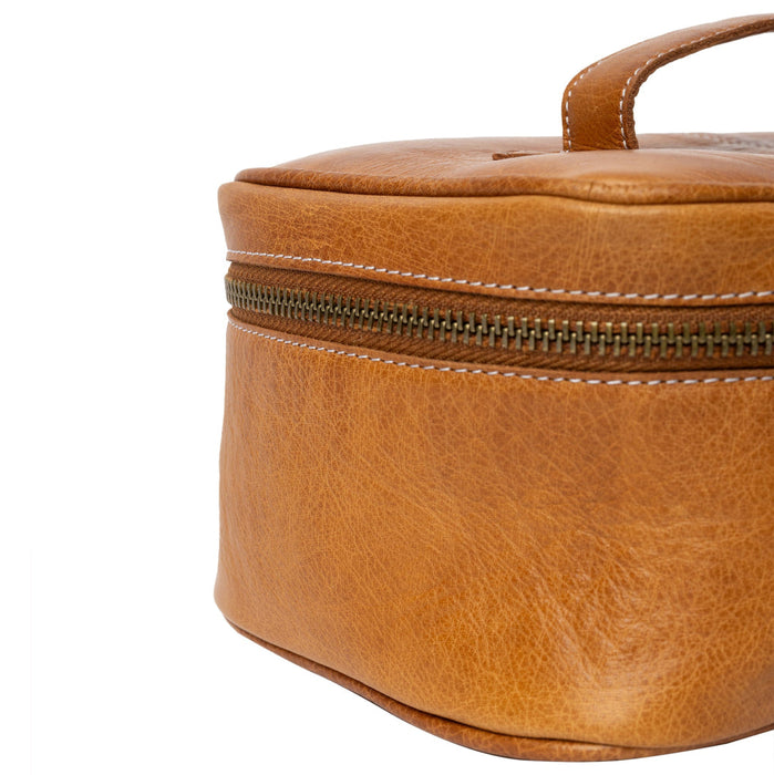 Knitting project bag in burned tan leather with zippered compartment and handle.