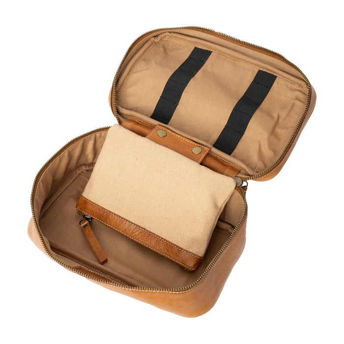 Knitting bag with tan leather, spacious zippered compartment, and inside pockets for organizing tools.