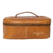 Knitting bag in burned tan leather with zippered compartment and handle.