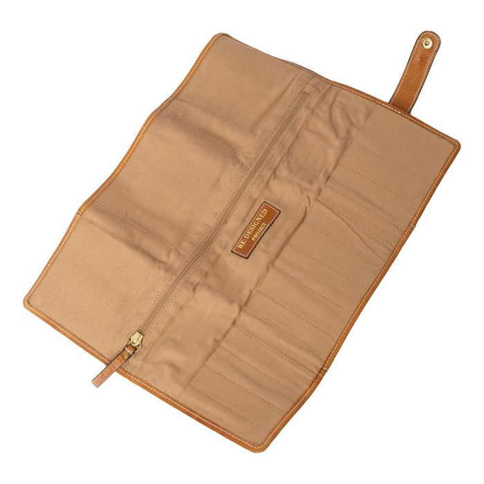 Knitting bag with brown leather, multiple pockets, and zip compartment.