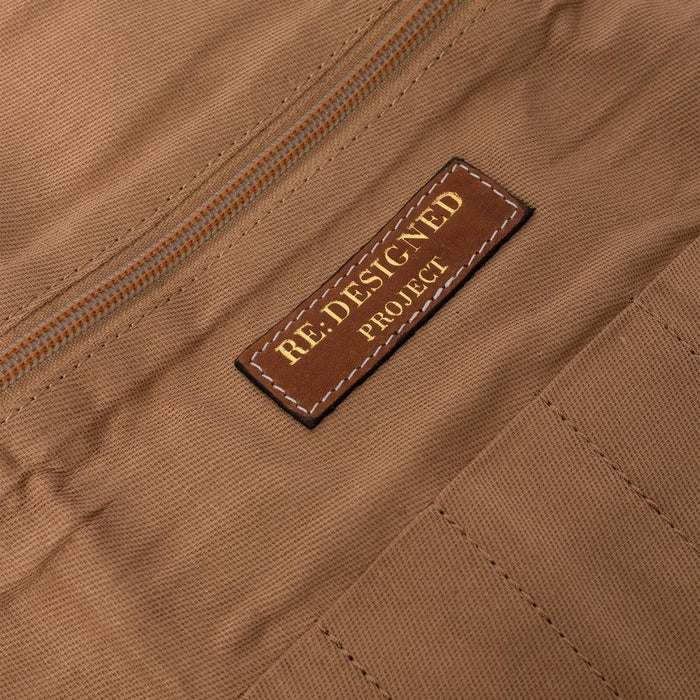 Knitting bag in walnut and gold leather with zip pocket and label.