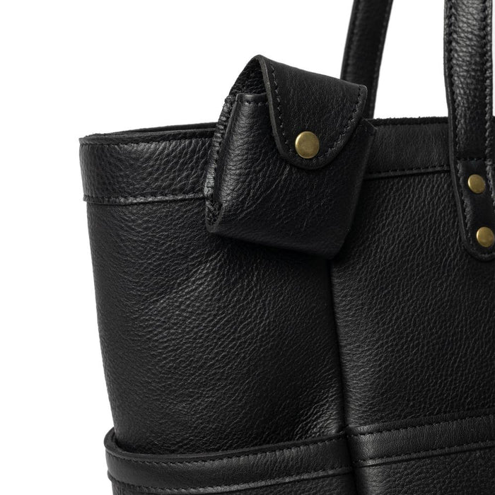 Black leather knitting project bag with compartments and shoulder handles.