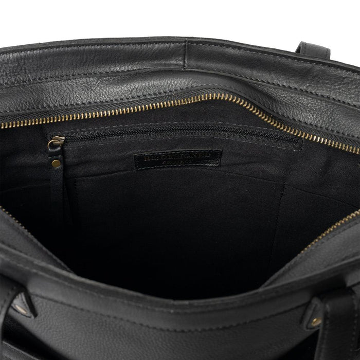 Black leather knitting bag with interior compartments and metal zipper.