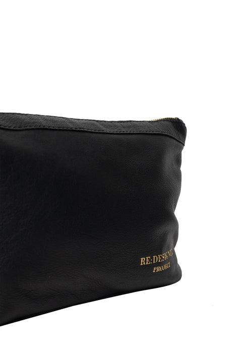 Black and gold leather knitting bag with zipper and pockets.
