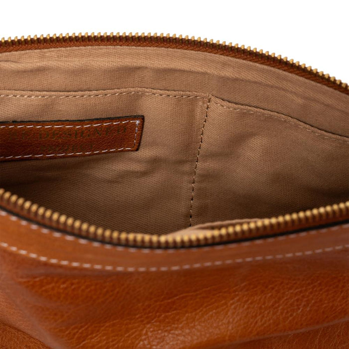 Knitting bag in burned tan/gold leather with interior pockets and metal zipper.