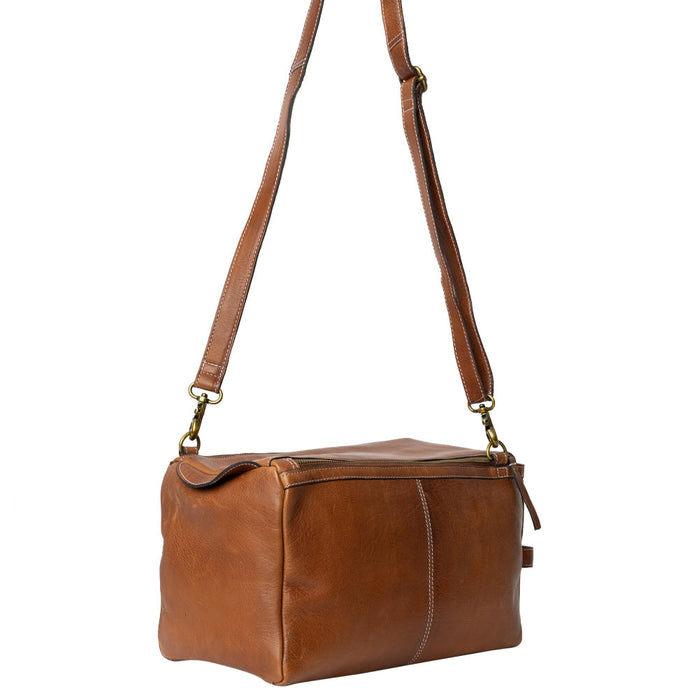 Leather knitting bag in walnut color with adjustable strap and multiple pockets for knitting accessories.