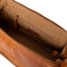 Luxurious leather knitting bag in burned tan with compartments for needles and notions, adjustable strap.