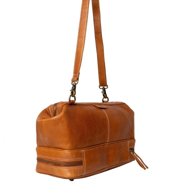 Luxurious burned tan leather knitting project bag with adjustable shoulder strap.