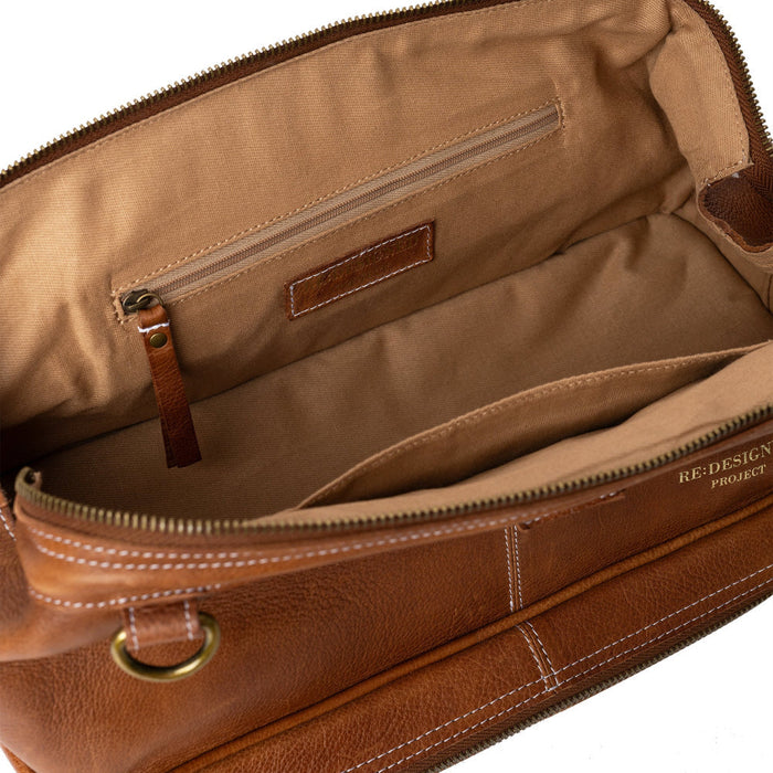 Luxury walnut leather knitting bag with needle compartment and pockets for knitters.